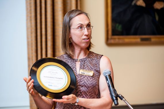Tina holding Sustainability Champion award