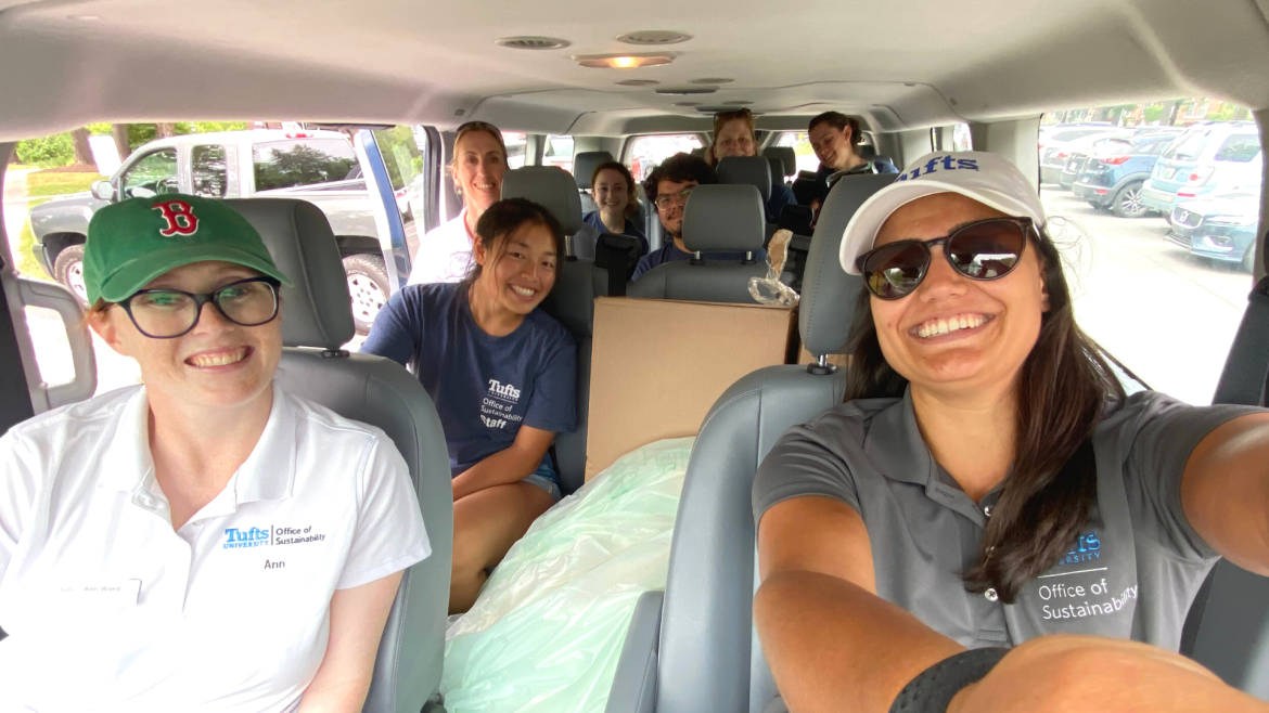 Selfie of eight people sitting in a van