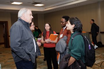 Tufts students, Malia Brandt, E25, and Noah Niwamanya, EG25, network with energy professionals during the 2025 IDEA Campus Energy Conference.