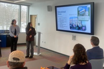 Tufts students present on their community engagement events for students to learn about campus energy.