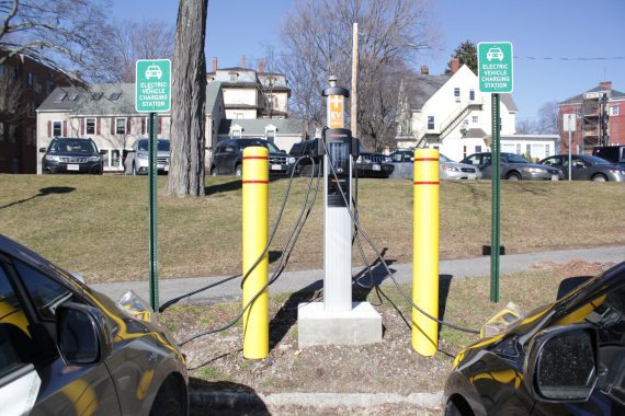 electric vehicle charging station with two cars plugged in