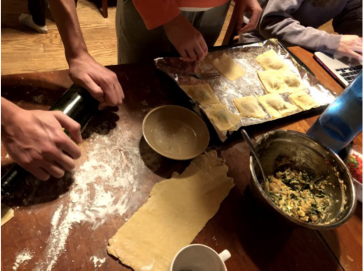 Close up of people making homemade pasta