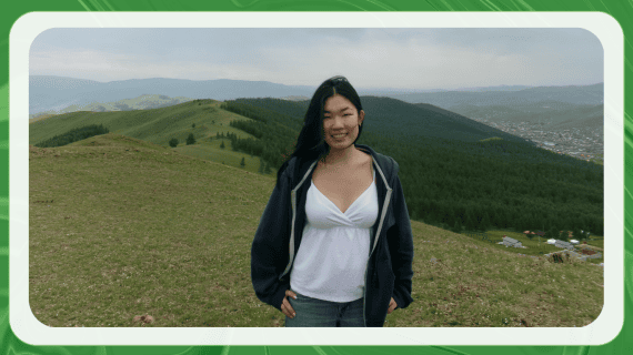 Photo of Sarnai in Mongolia, in front of green mountains